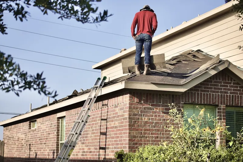 Professional roofer working on a residential roof in Stockholm